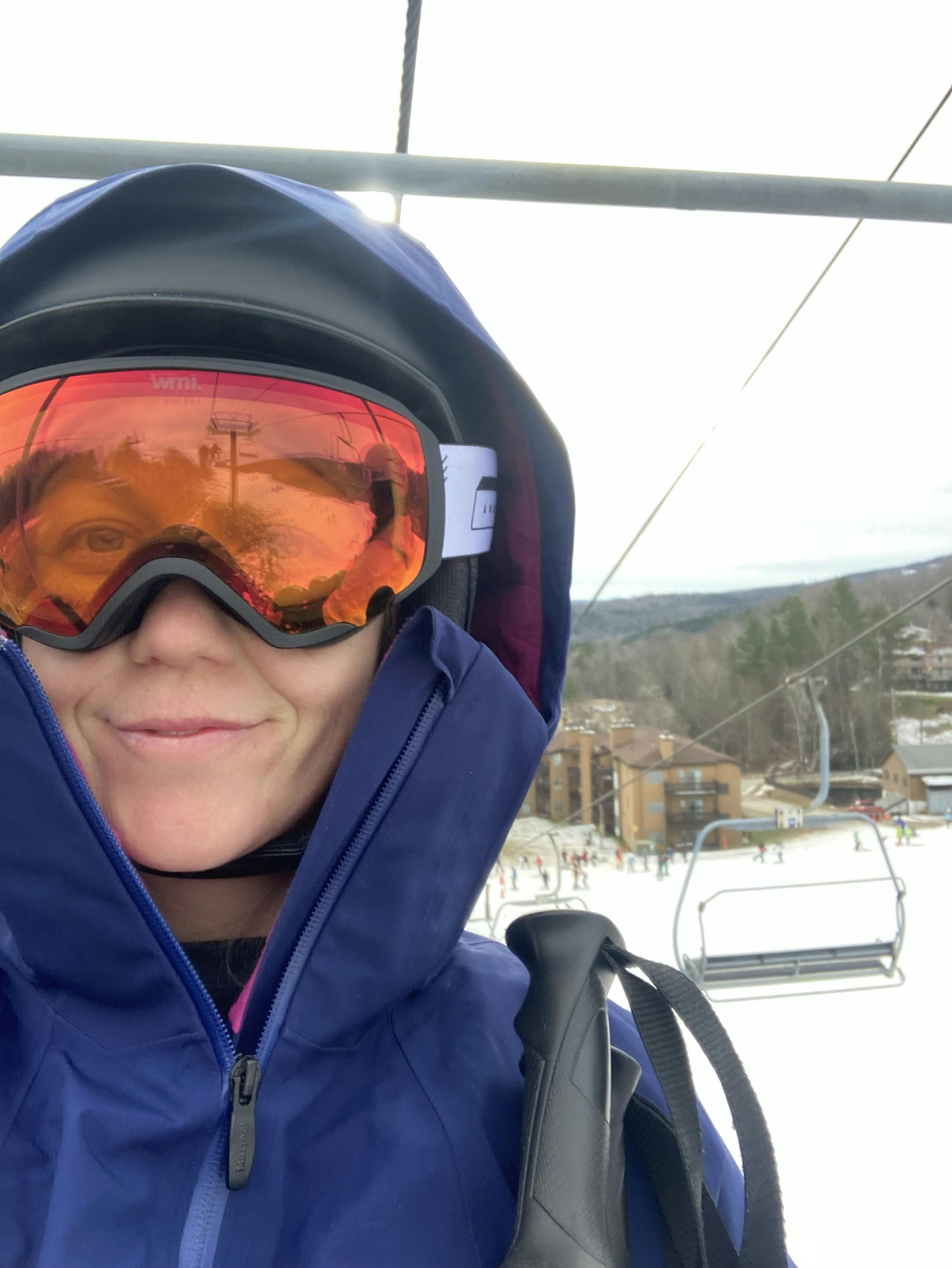 A skier wearing the Anon Logan Wavecel Helmet.