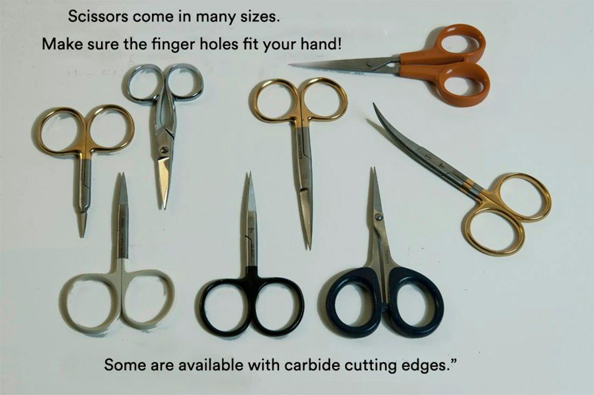An image of eight small scissors on a white background. The text reads, "Scissors come in many sizes. Make sure the finger holes fit your hand! Some are available with carbide cutting edges."