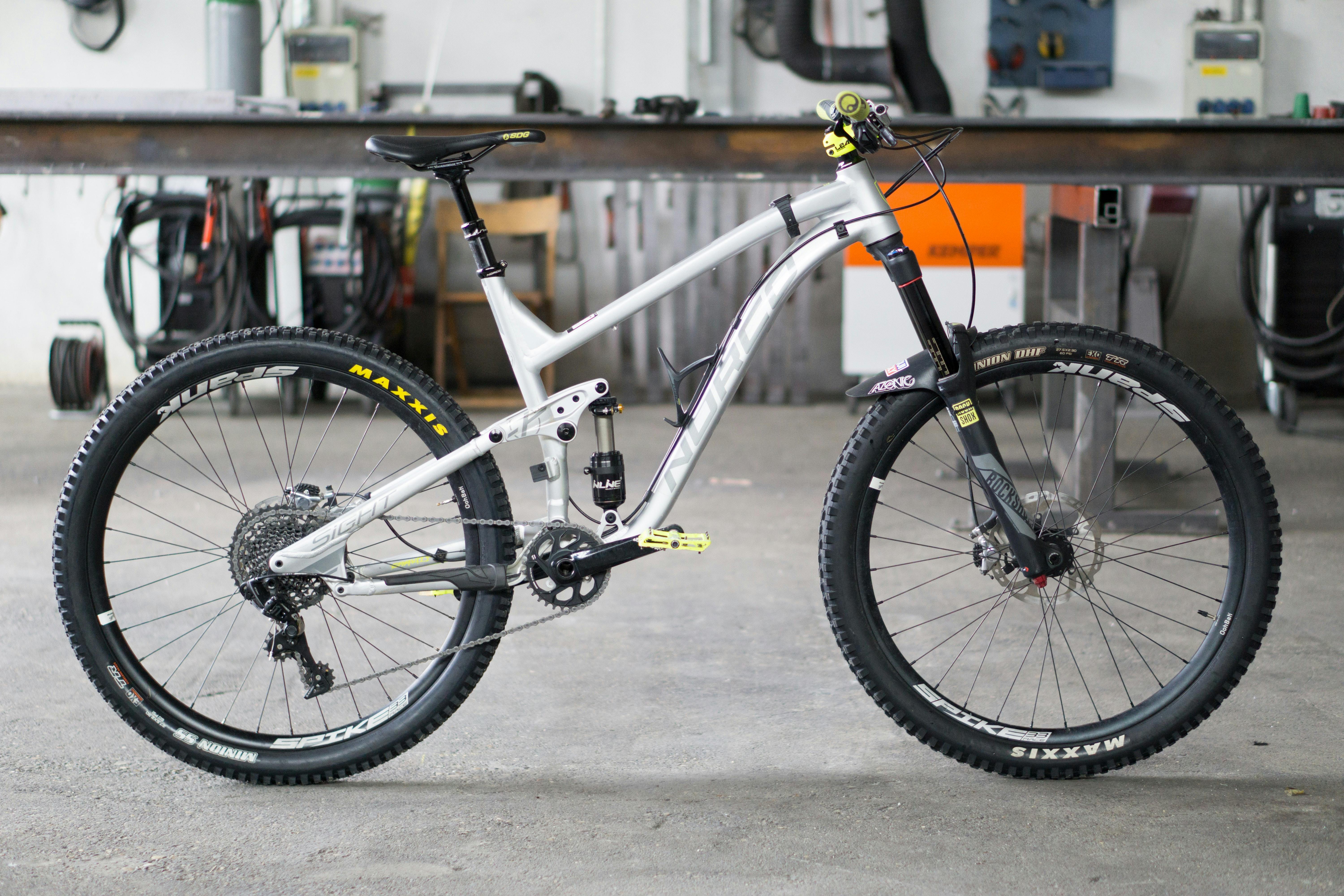 A white mountain bike in a garage