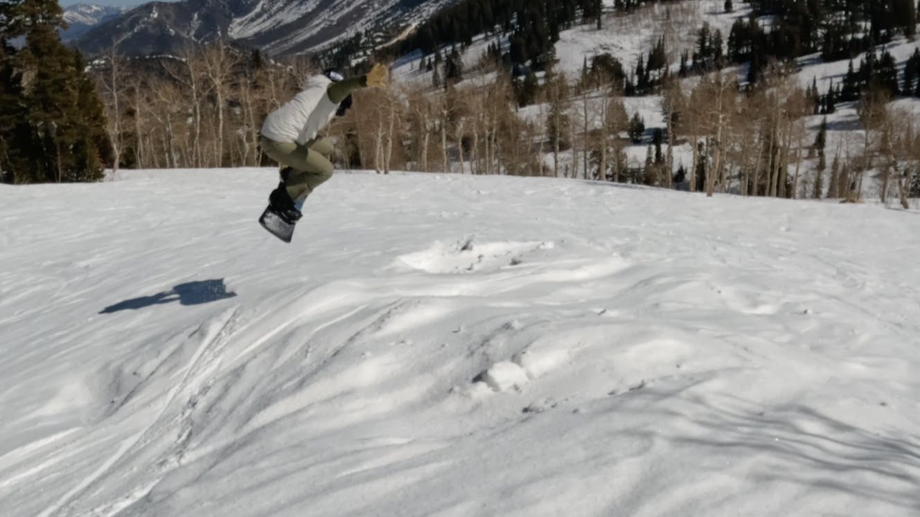 A snowboarder riding the 2023 Lib Tech Box Knife Snowboard.