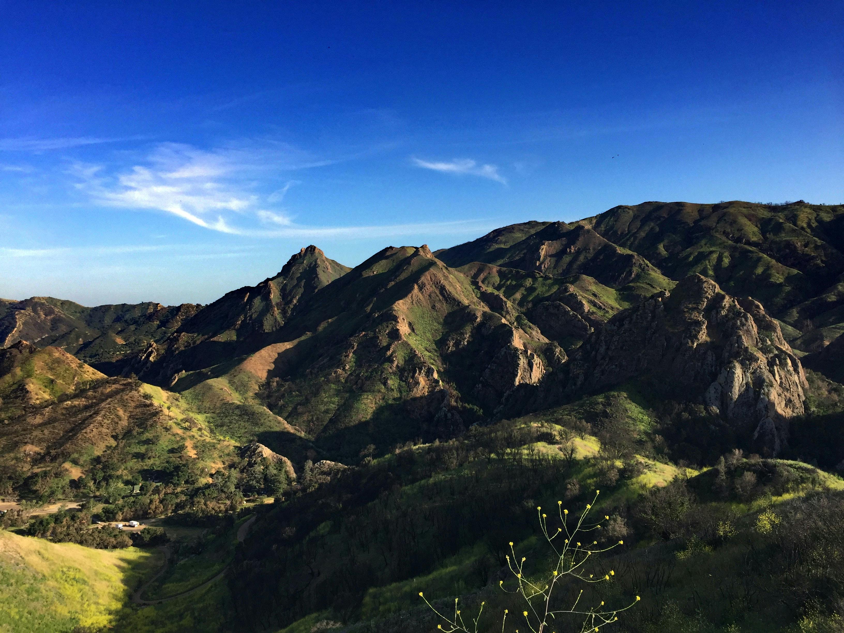A photo of the Santa Monica Mountains. They are green and covered in brown scrub brush