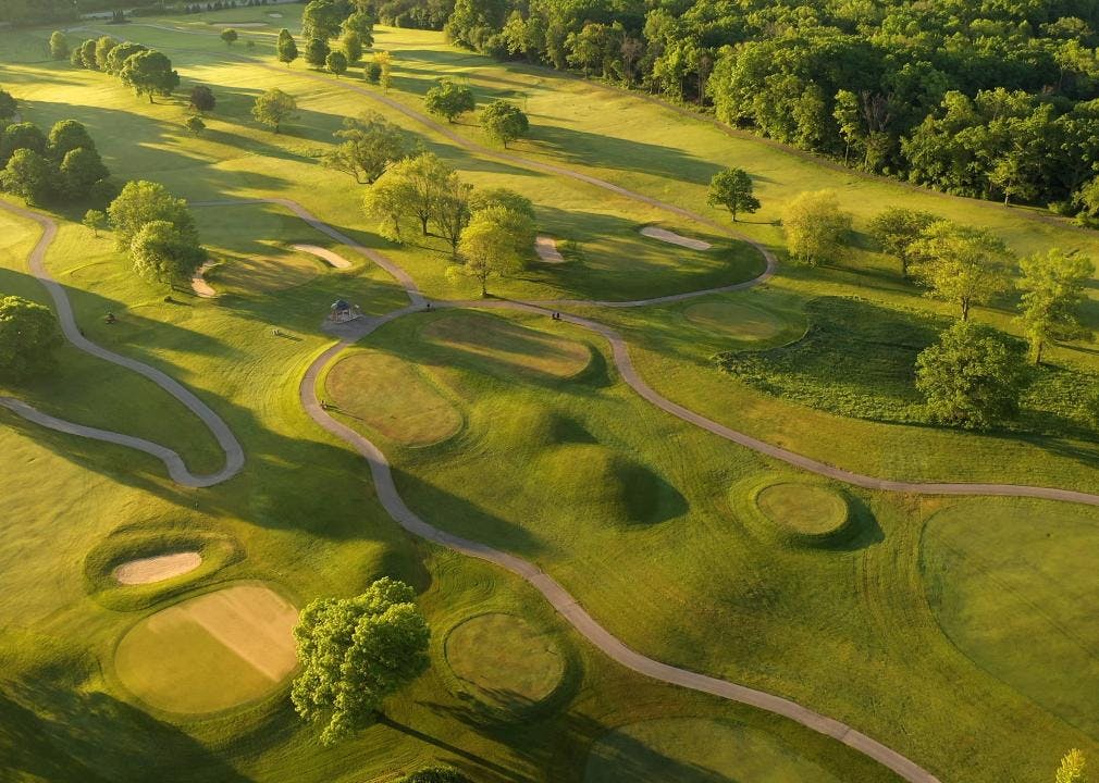 Aerial view of a golf course at sunset