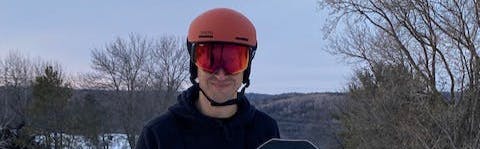 A man wearing the Smith 4d MAG Goggles and a helmet. 
