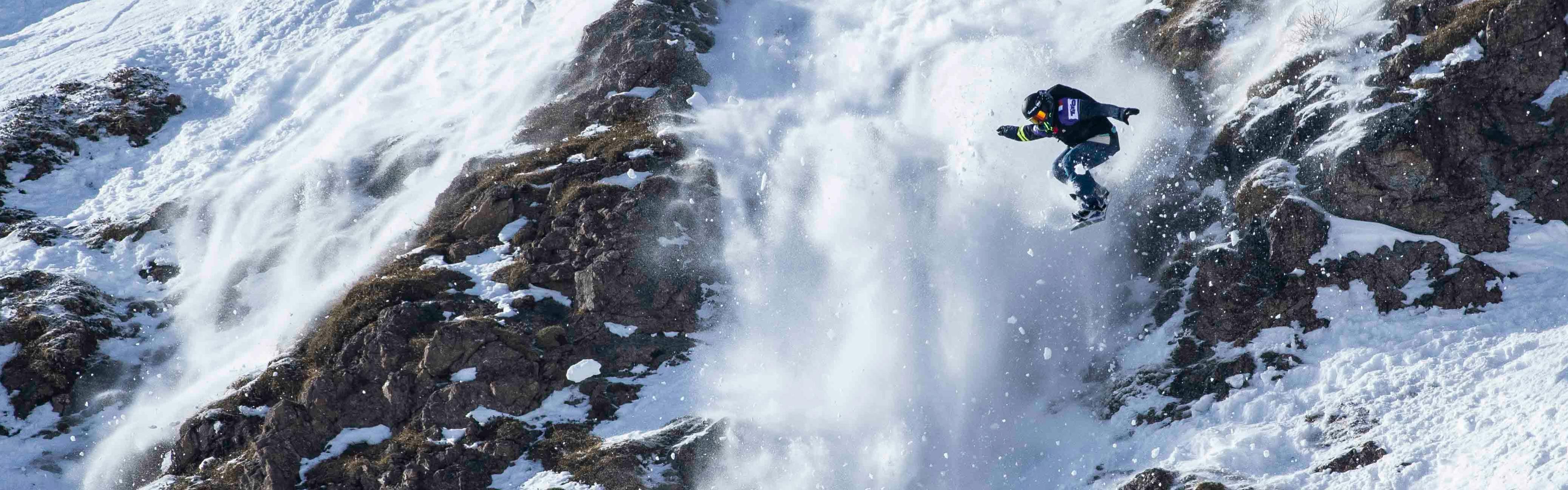 A snowboarder catches air on their way down the FWT run in Austria. 