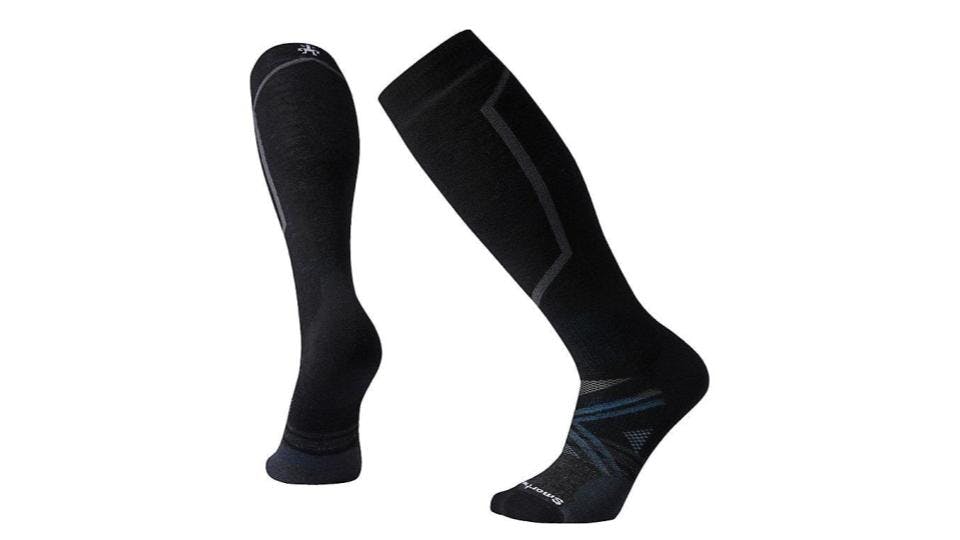 Two black socks with a blue stripe on the foot and some grey triangles.