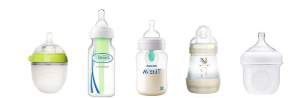 Different baby bottles in a line.