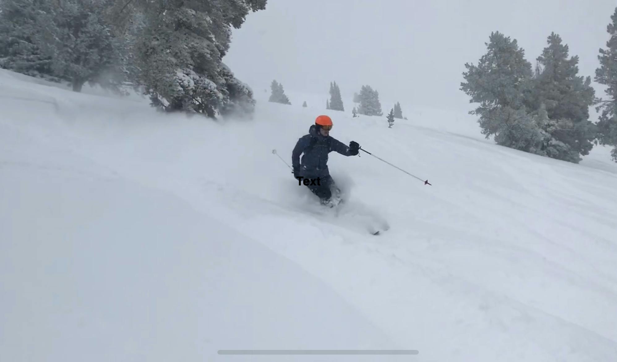 A skier turning down a powdery run on his Armada ARV 116 JJ Skis · 2022.