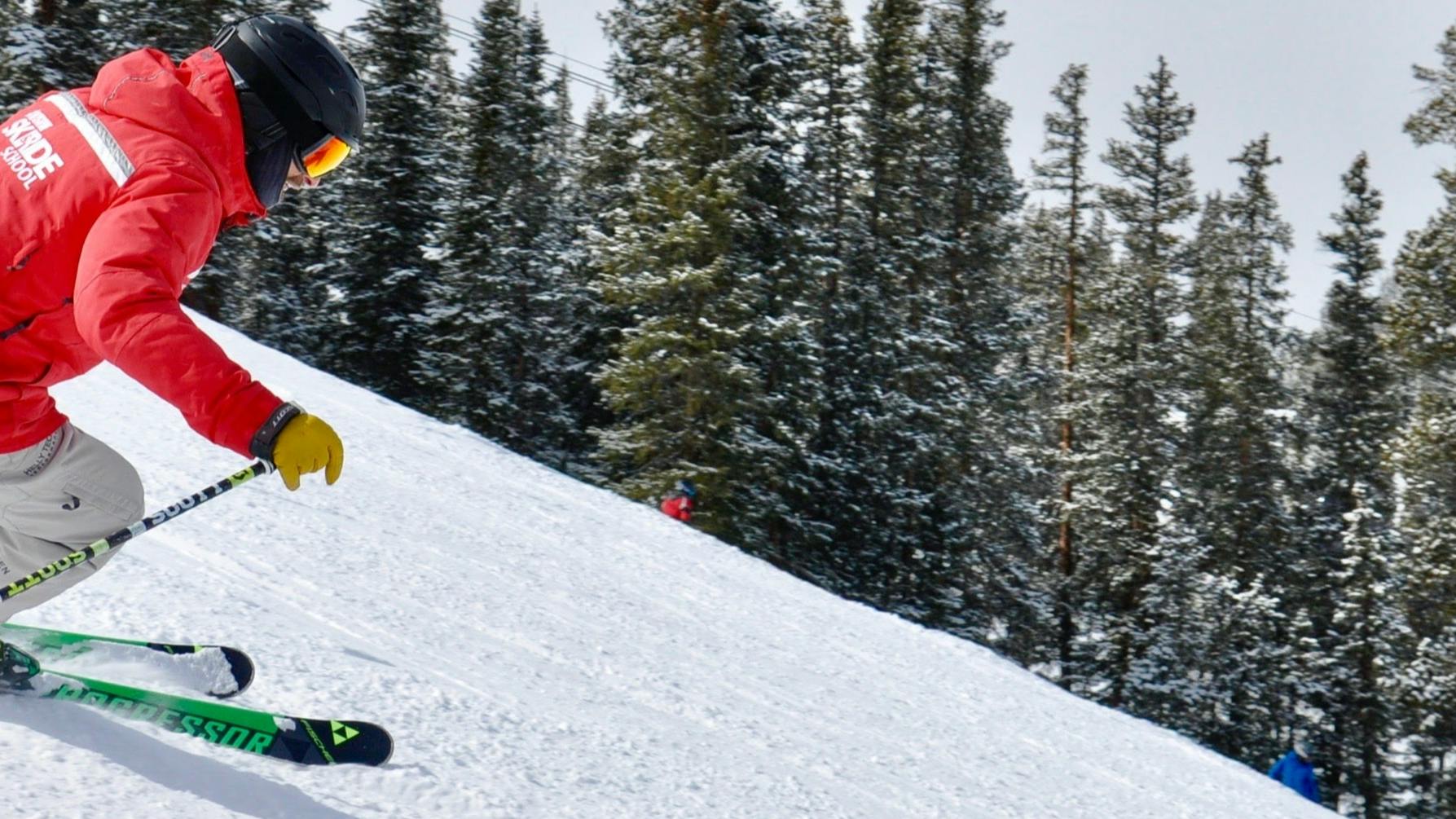 A skier turns down a mountain. 