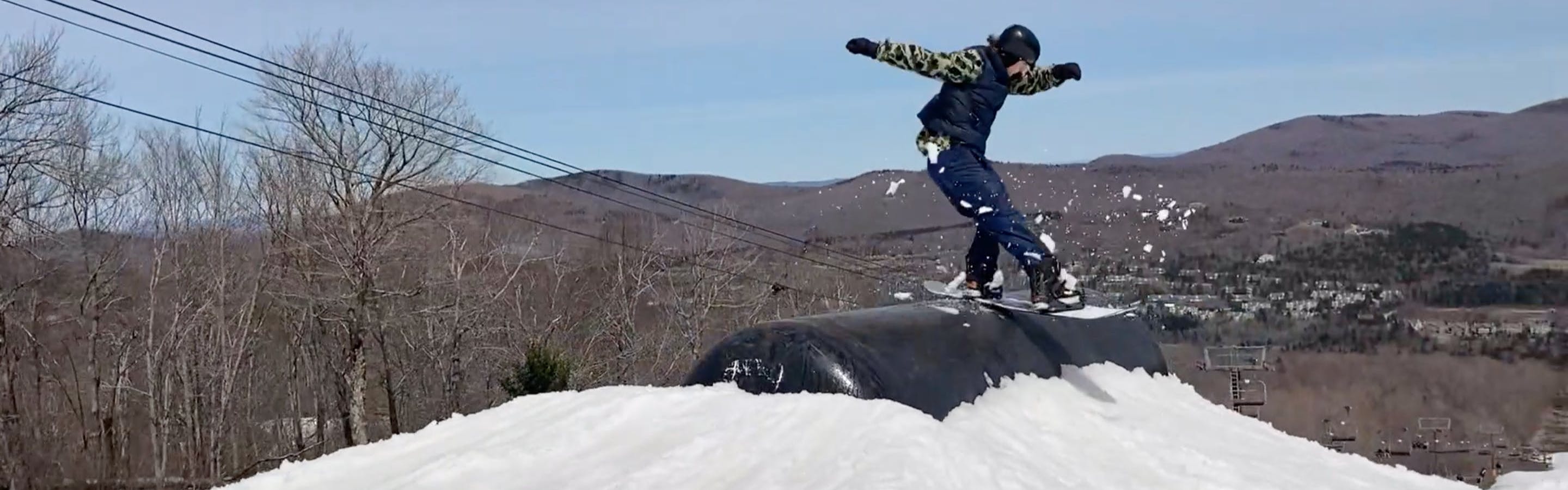 A snowboarder flexing out a lip slide with the Union Flite Pro bindings.