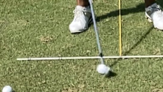 A man golfing with the Callaway APEX MB 21 Iron.