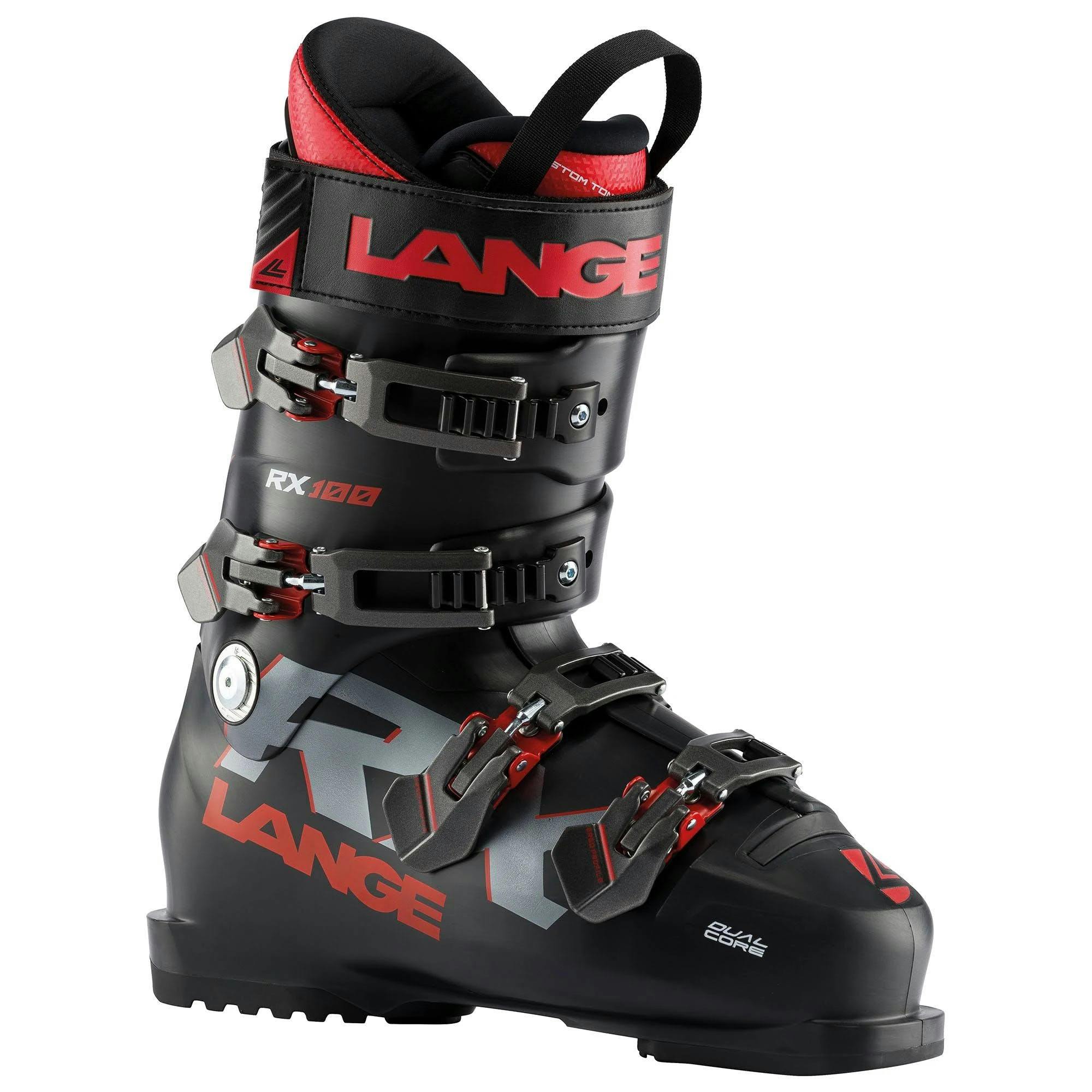 A black ski boot with red accents and two labels reading Lange