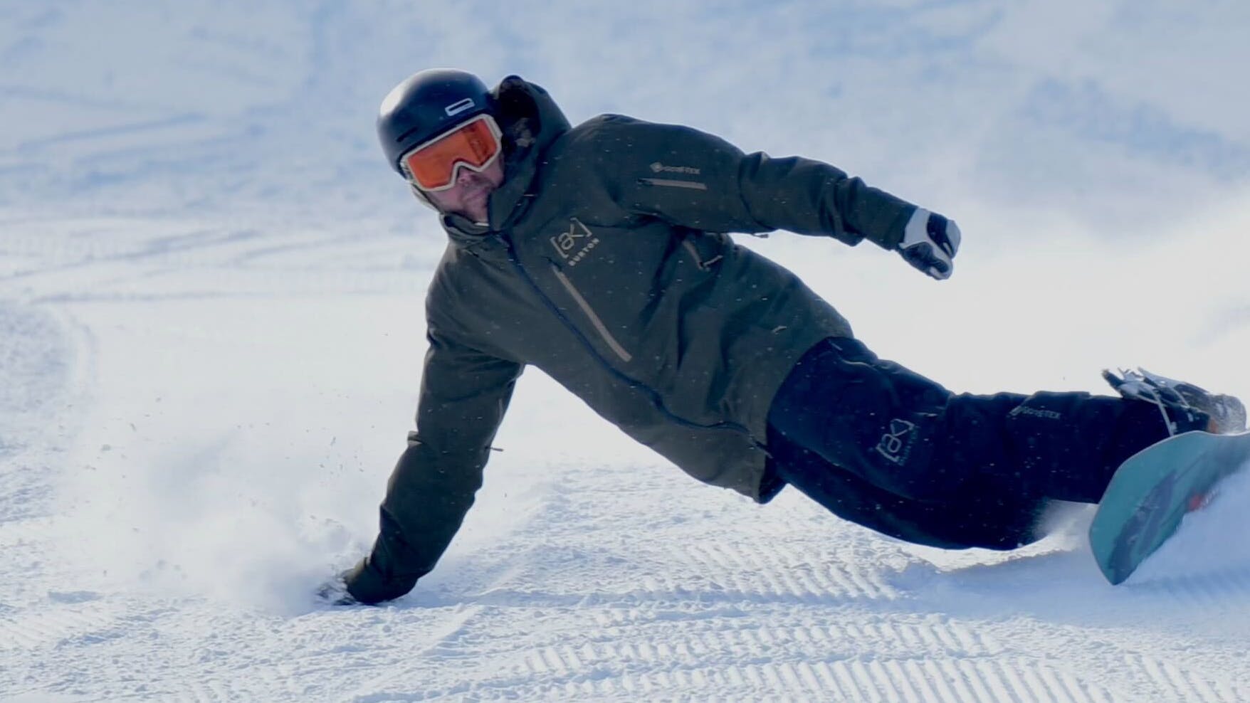 Eric Schultheiss rides his K2 Party Platter snowboard and carves a turn on it.